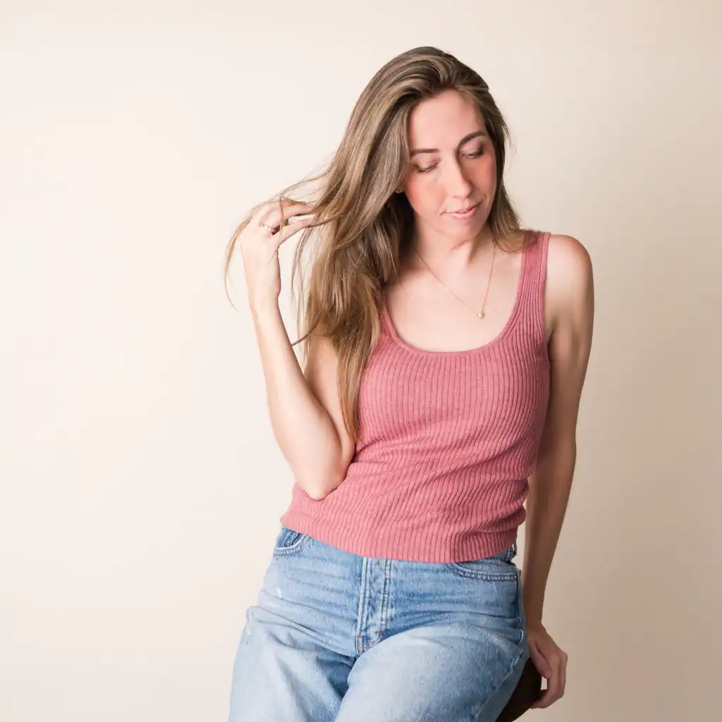 Bonnie Headshot-Square Florida based Artist headshot looking down and away from the camera, capturing a quiet, introspective moment in the creative process