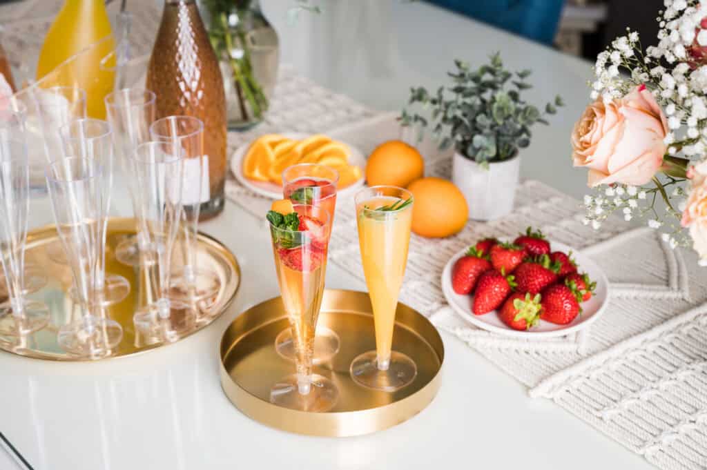 FlutesIceBucketLifestyles-3014 High-end lifestyle flat lay featuring champagne flutes and citrus, great for Amazon kitchen, barware, or entertaining products.