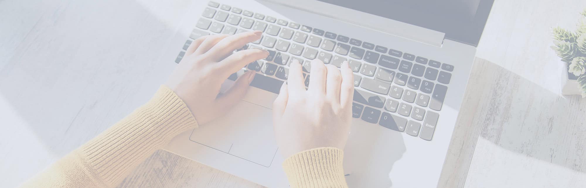 Female entrepreneur writing website copy, symbolizing strategic and aligned messaging for service-based business websites.