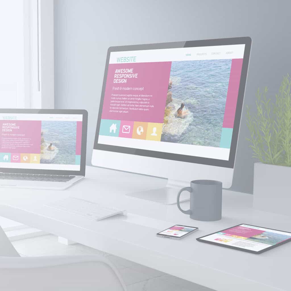 fresh modern website design for conscious brands and entrepreneurs Laptop and tablet on desk displaying colorful website layouts for a modern business