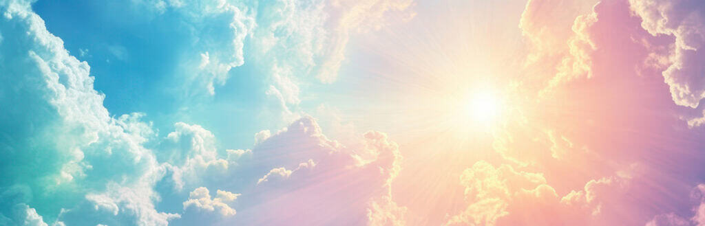 Sunlight sparkling through pastel rainbow skies, evoking the ethereal tone of spiritual website design