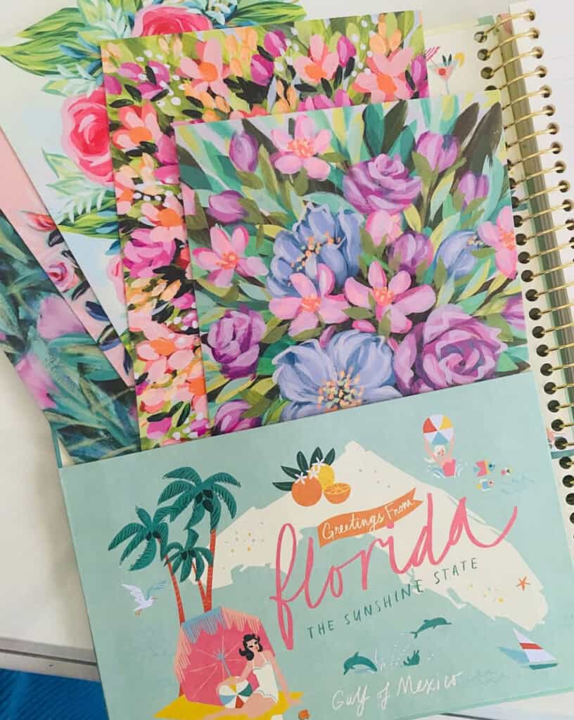A colorful stack of Florida-themed art postcards with the text “Greetings from Florida,” promoting Bonnie Sorsby’s art-filled email newsletter, Love Letters.