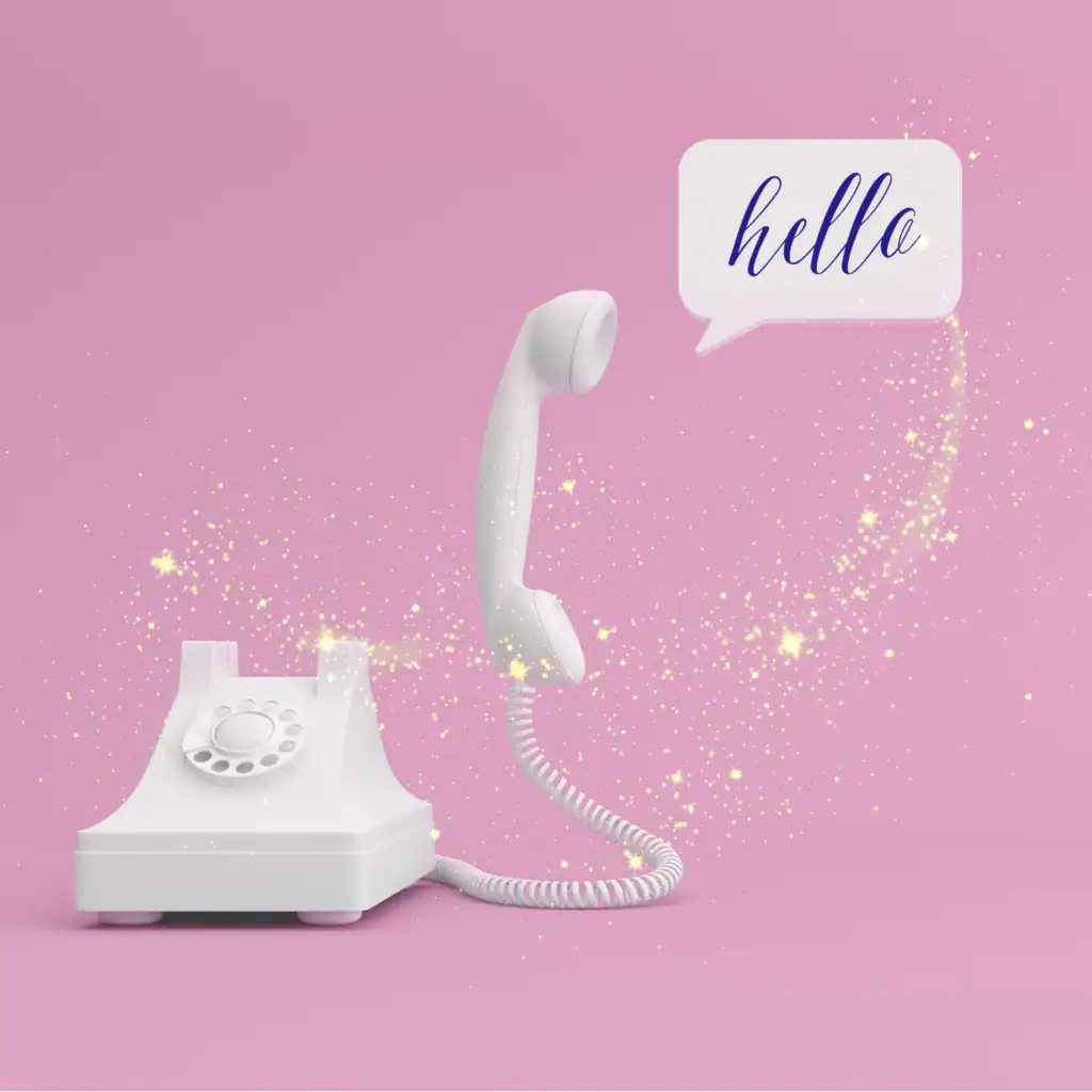 White landline phone with sparkle and “hello” text bubble on a pink background, symbolizing boutique-style marketing support and creative web design