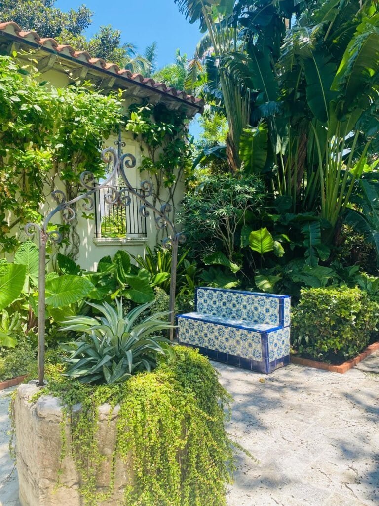 Tropical garden landscape at Society of the Four Arts with palms and shaded paths