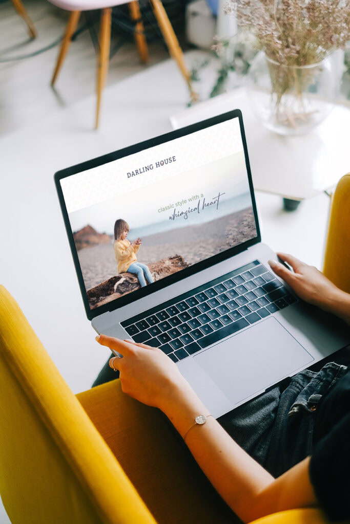 Palm Beach web design example — Darling House homepage mockup displayed on laptop in lifestyle setting.