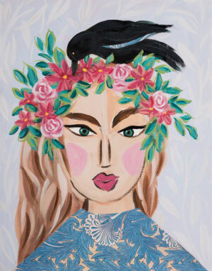 womans face painting with a black bird on her head and a patterned blouse with a flower crown