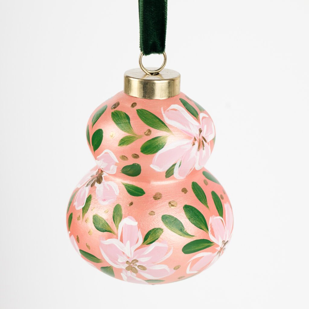 Blush pink floral Christmas ornament with gold shimmer and green accents; handcrafted by Florida artist, grandmillennial or feminine boho style.
