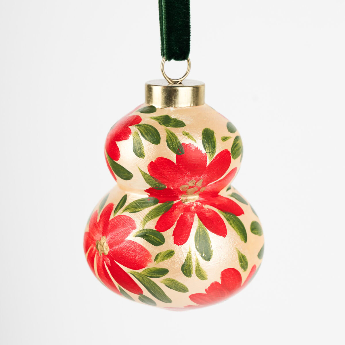 Vibrant red floral ornament with gold details; artist-painted in Florida, ideal for colorful living and bold modern holiday decor.