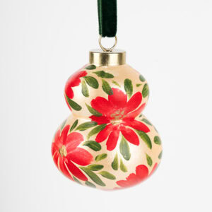 Vibrant red floral ornament with gold details; artist-painted in Florida, ideal for colorful living and bold modern holiday decor.