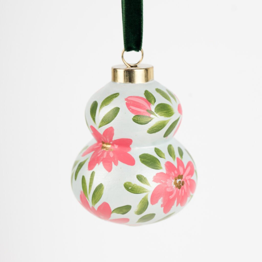 Artist-painted floral Christmas ornament in red, pink, light teal and blue hues by Florida artist; modern boho decor, perfect for grandmillennial homes.