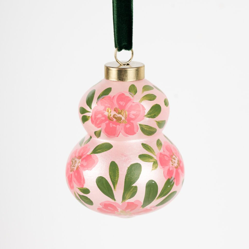 Blush pink floral Christmas ornament with gold shimmer and green accents; handcrafted by Florida artist, grandmillennial or feminine boho style.