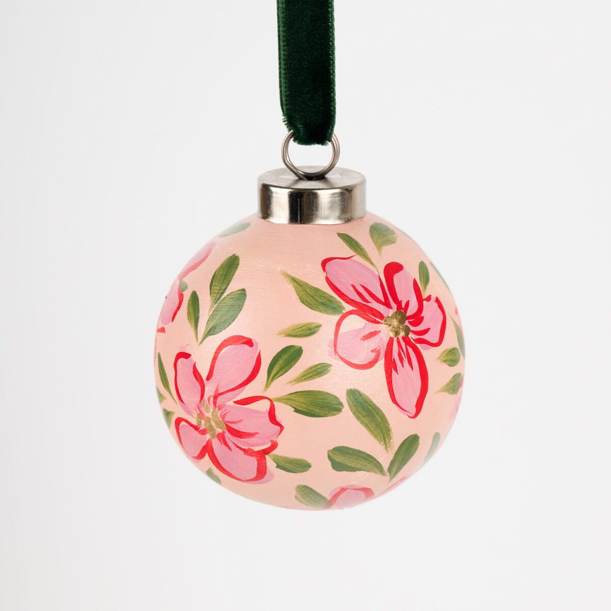 Vibrant red floral ornament with gold details; artist-painted in Florida, ideal for colorful living and bold modern holiday decor.