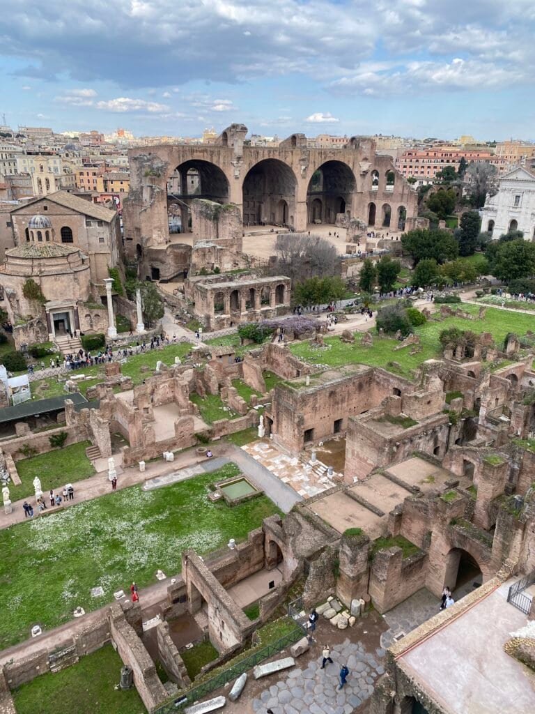 Remains of historic Roman architecture showcasing arches, columns, and ancient structures in the heart of Rome.