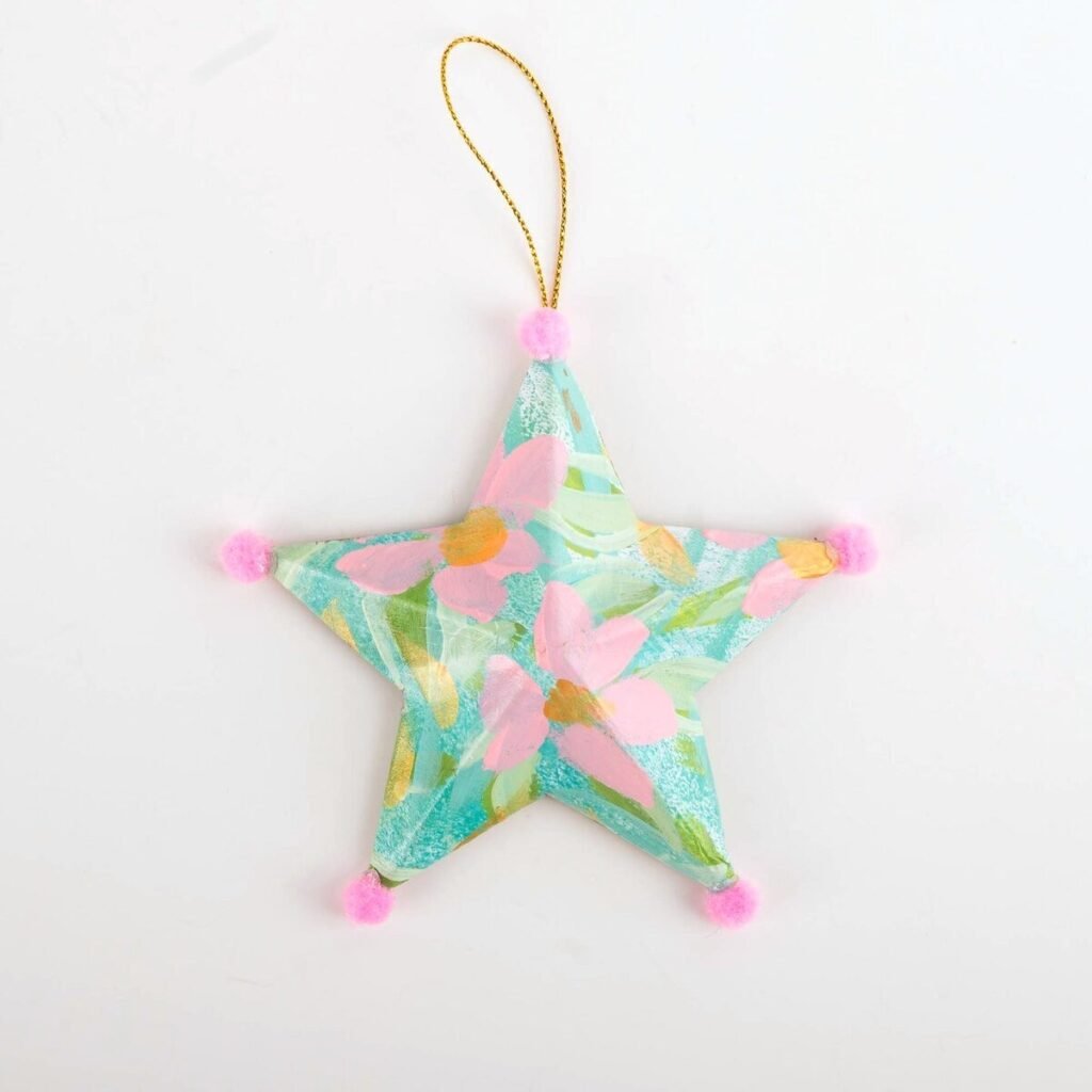 Hand-painted star ornament No. 1 by Bonnie Sorsby, florals in aqua with soft pink flowers with pink pom poms on each point and a gold hanging cord