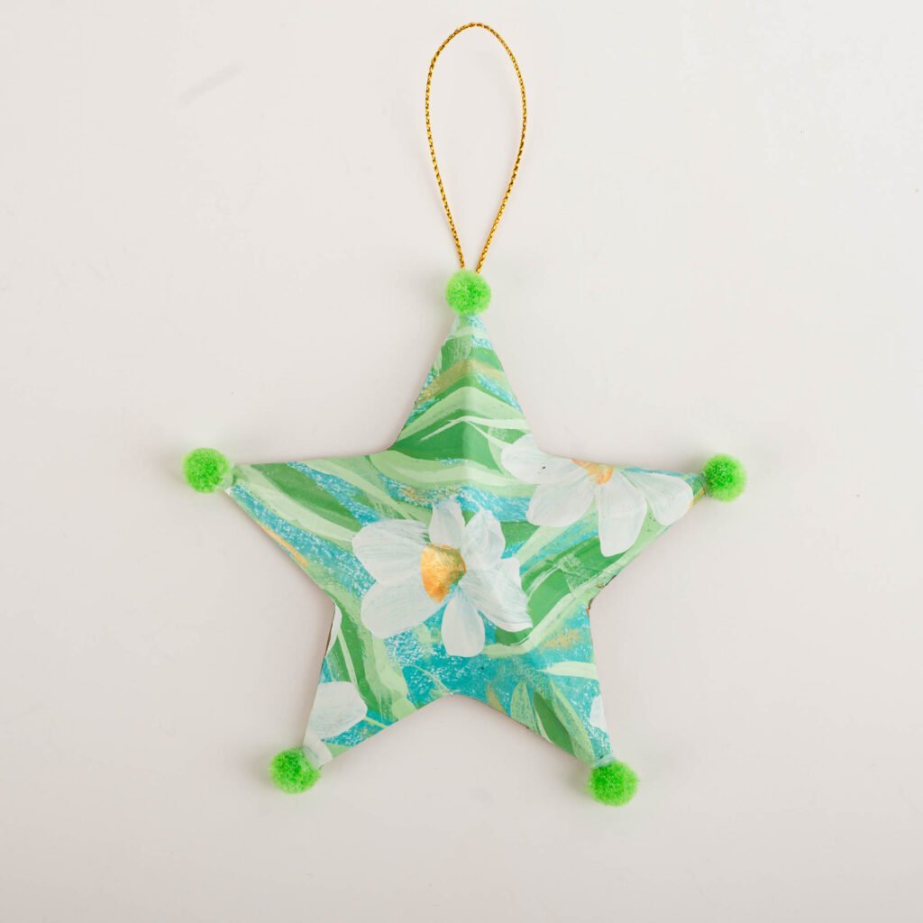 Hand-painted star ornament No. 5 by Bonnie Sorsby, florals in green and aqua with a white flower with green pom poms on each point and a gold hanging cord