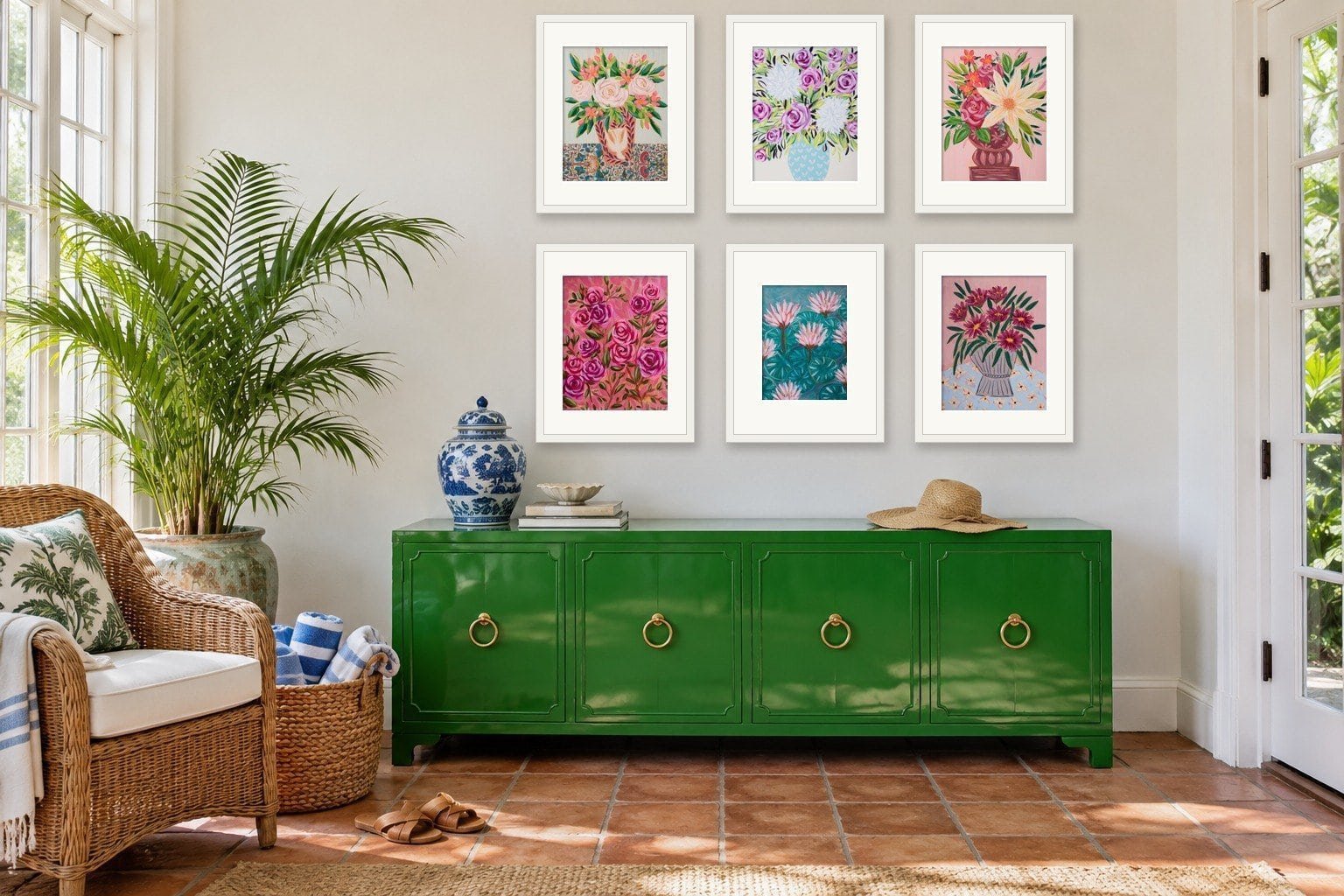A large wall decorated with a 3 by 2 grid of 6 framed small floral originals by Bonnie Sorsby above a Kelly green lacquered credenza in a Palm Beach sunroom