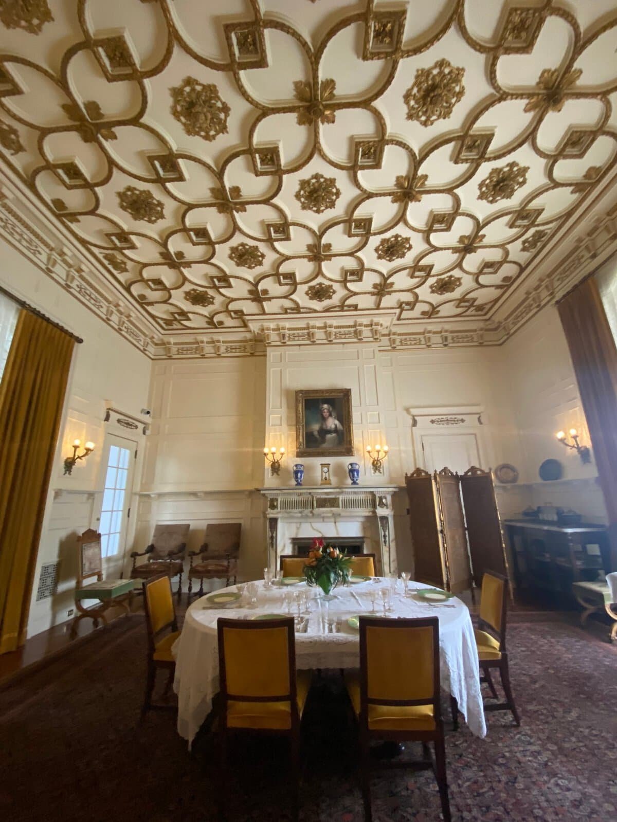 ornate dining room ceiling and table at Whitehall, the Flagler Museum in Palm Beach