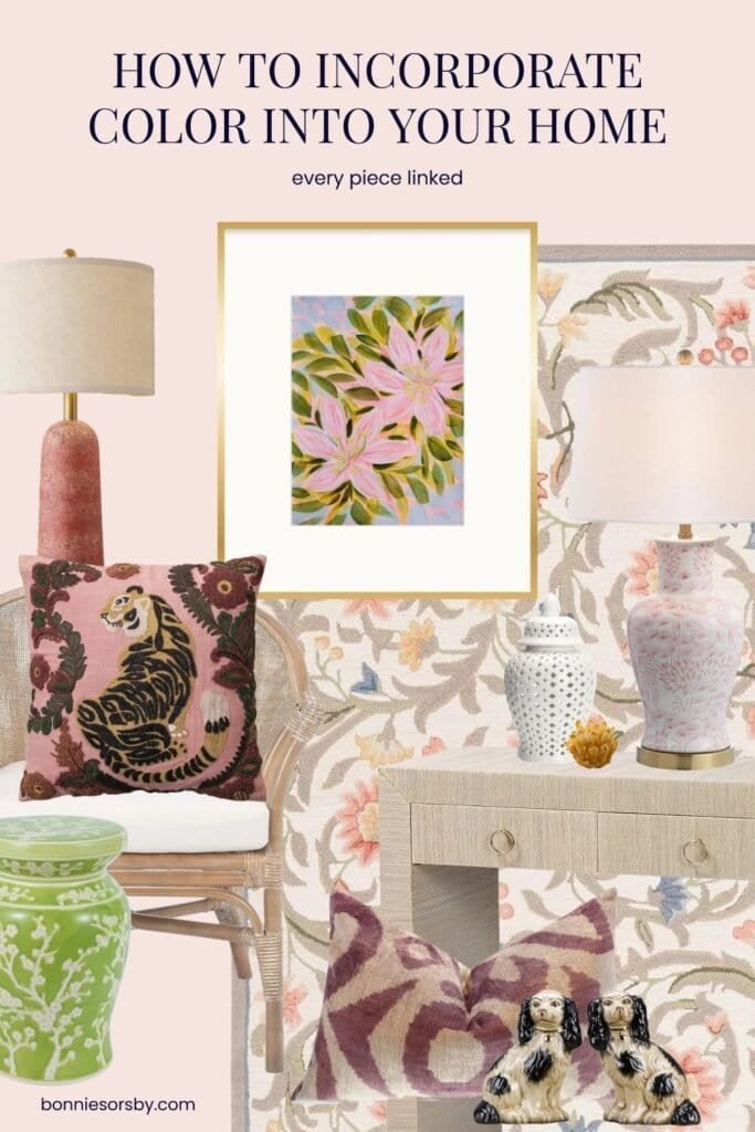 Pink and green room idea on a blush wall with Bonnie Sorsby’s painting Living Like the Lilies 1 in a gold frame, a pink tiger pillow on a rattan chair, a lime green garden stool, a terracotta lamp, a pink and white lamp on a grasscloth console, a floral wool rug and King Charles spaniel figurines